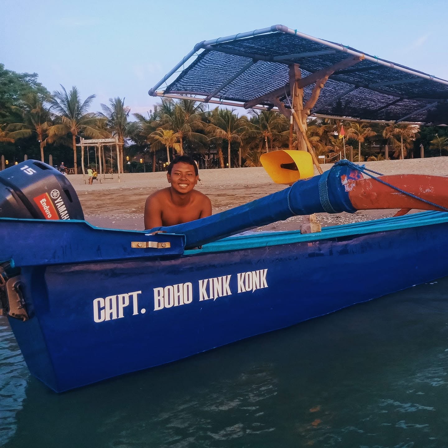 Capt. Boho Kink Konk outrigger boat on the beach behind The Anvaya